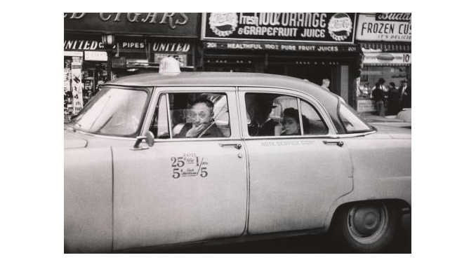 rev-6-taxicab-driver-at-the-wheel-with-two-passengers-nyc-1956